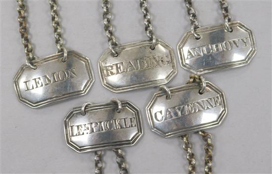 A harlequin set of 5 George III silver sauce labels by Rawlings & Summers